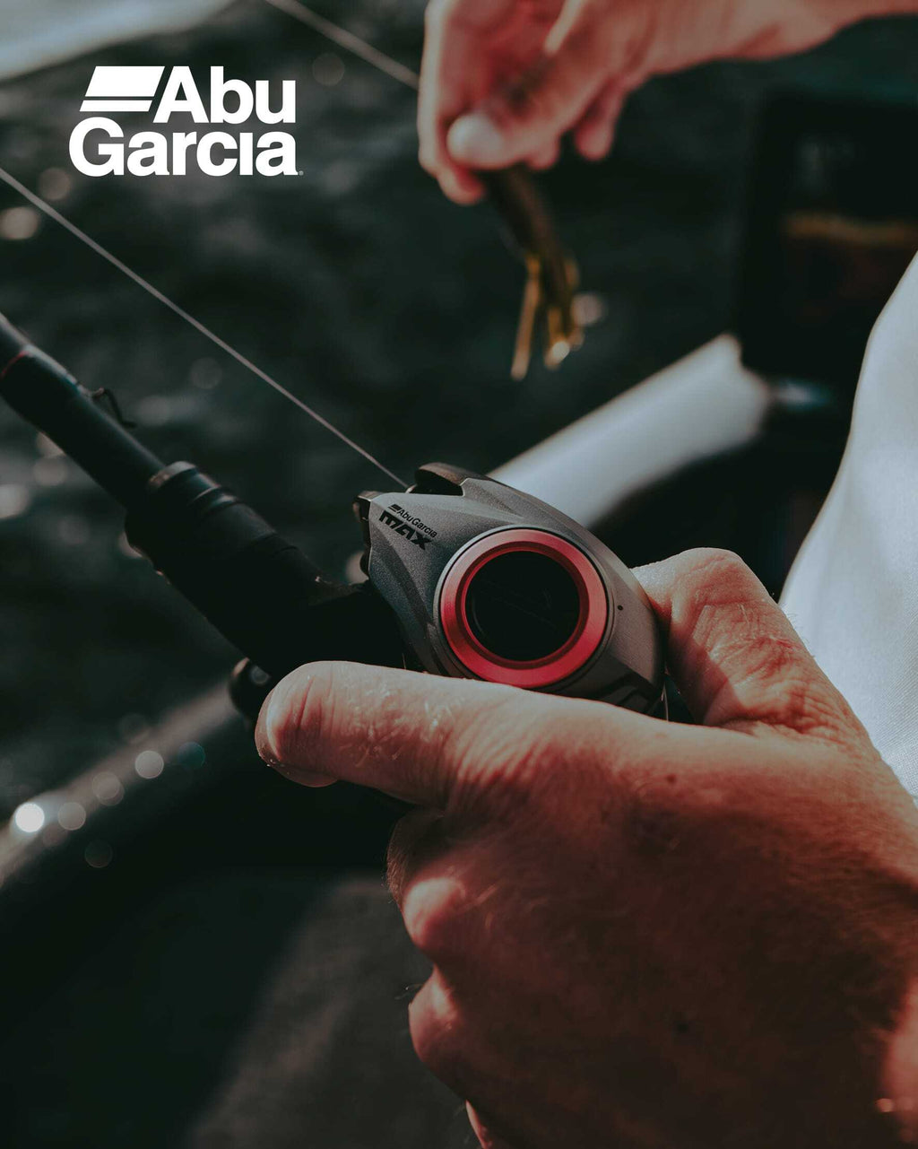 Close-up of a fishing reel with Abu Garcia branding.