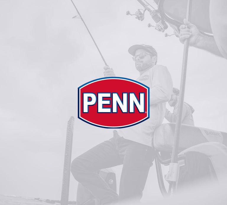 Man fishing with a blurred background featuring the Penn logo.