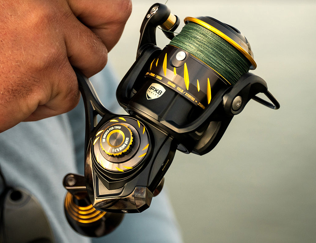 Close-up of a fishing reel with a blurred background